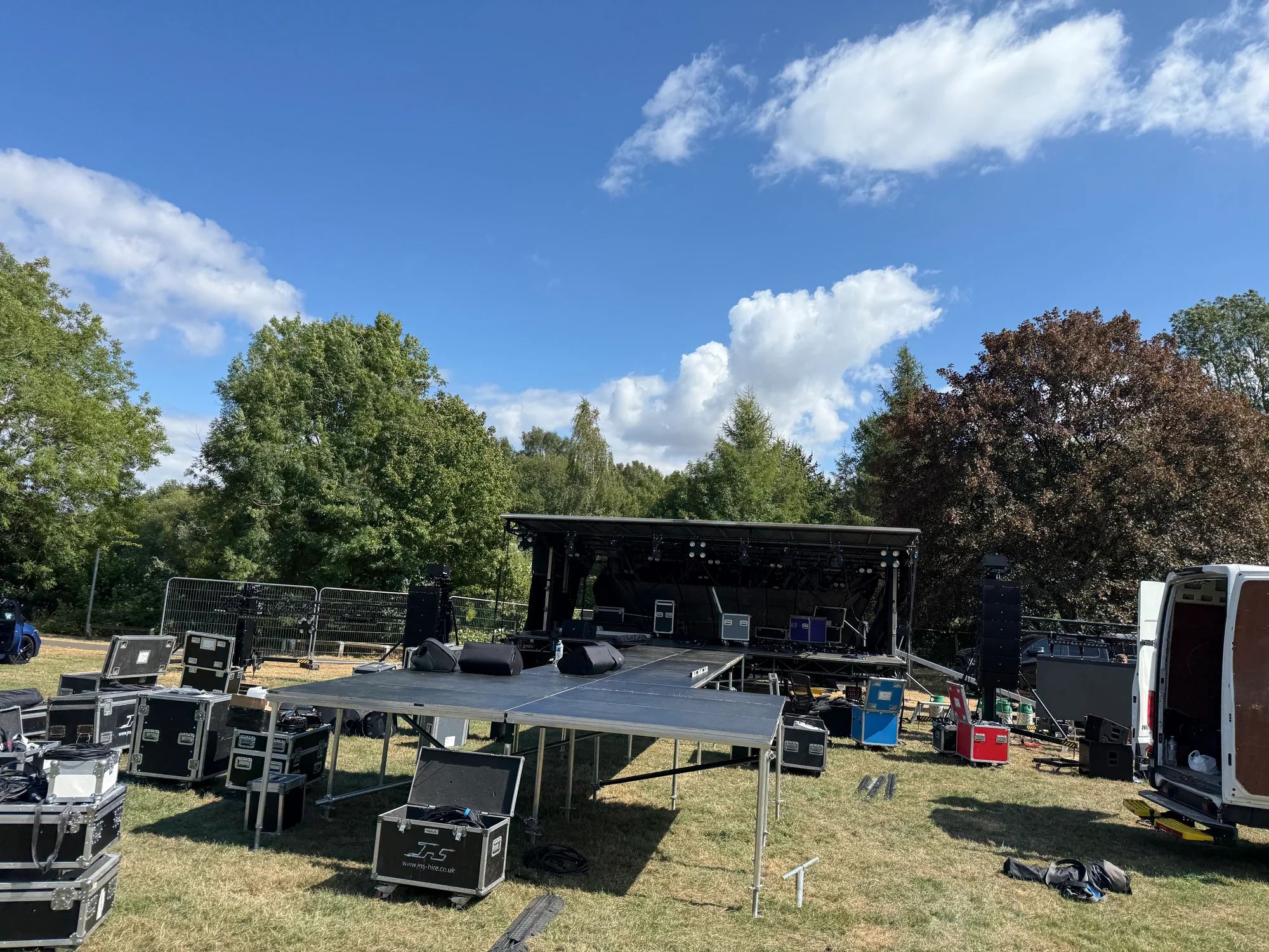 Ashfield Show trailer stage with its roof lowered while the long catwalk and lighting equipment are being set up