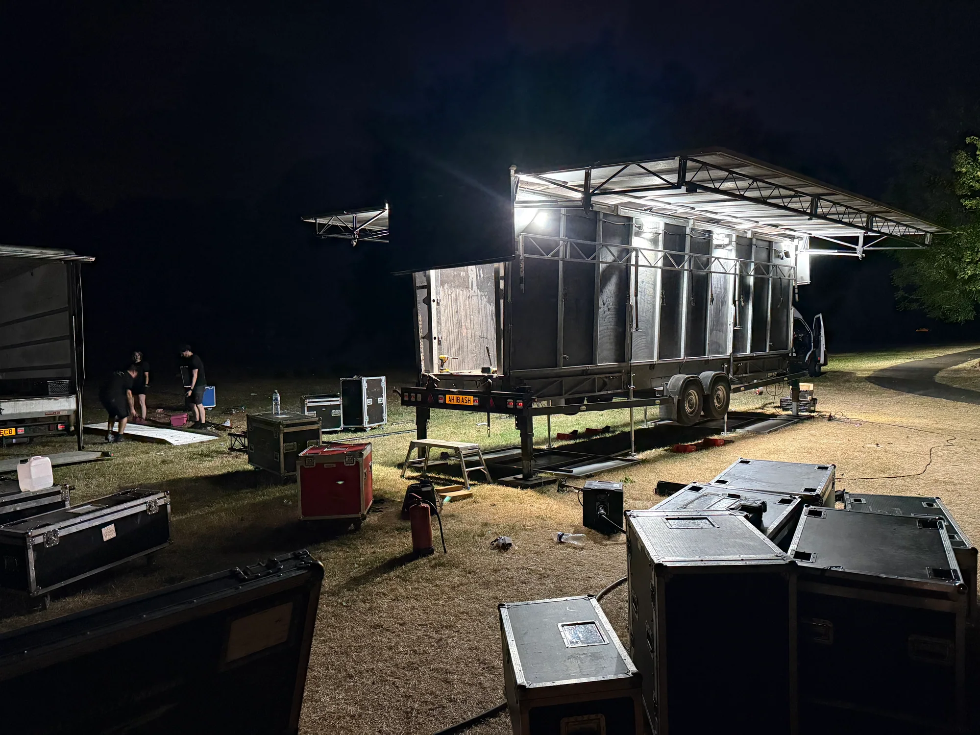 Trailer stage folded for load-out under its work lights after Ashfield Show