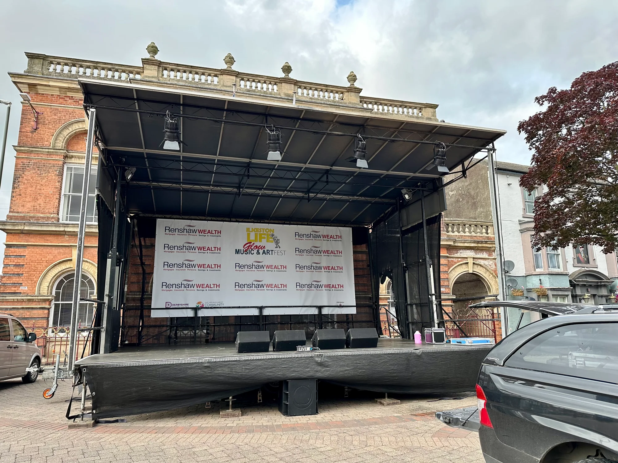 Completed Ilkeston Glow Festival stage with the rear event banner before the show