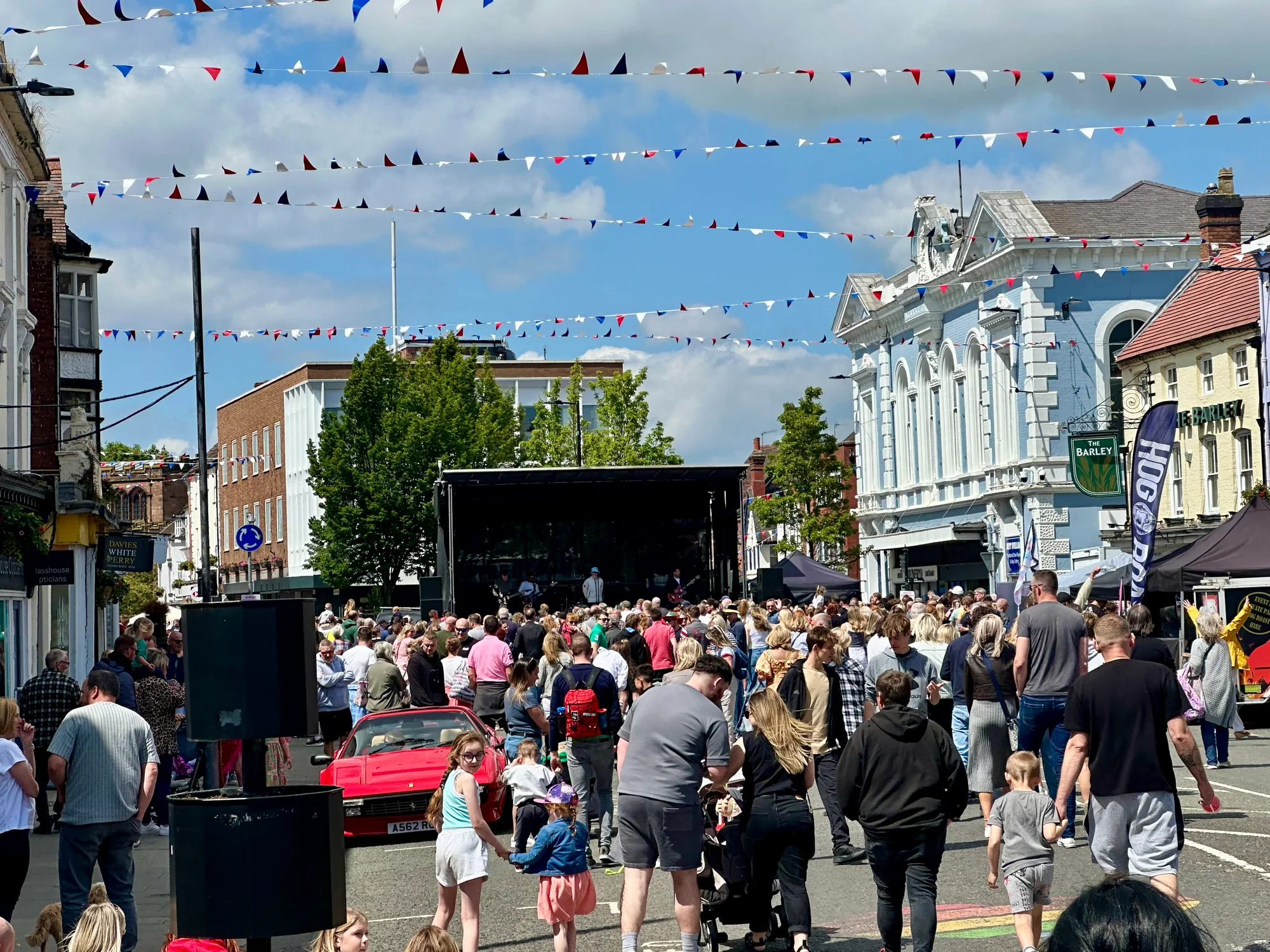 Crowd watching the main stage along Newport High Street during the 2024 carnival