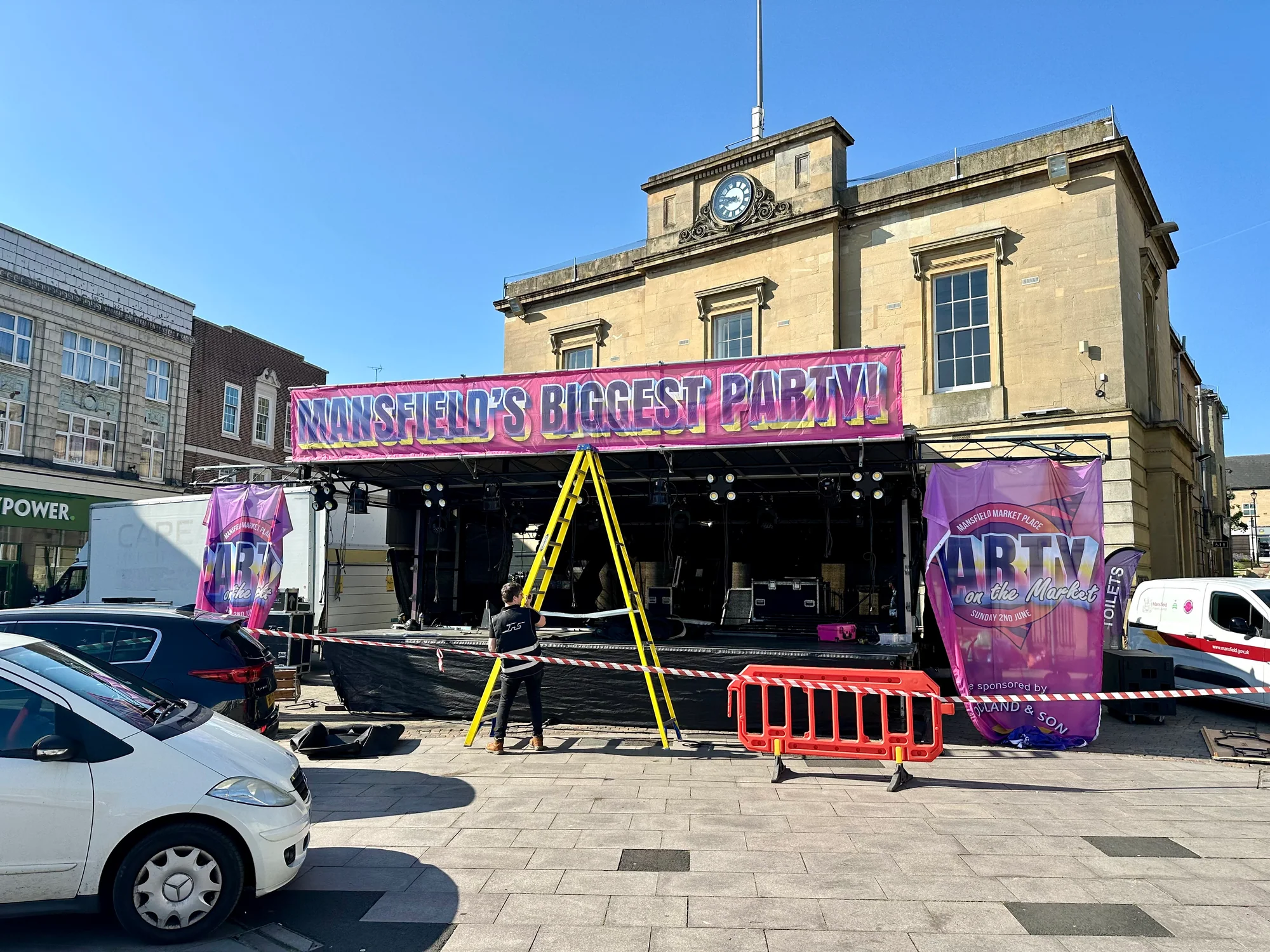 Party on the Market trailer stage being rigged with its roof lowered in Mansfield