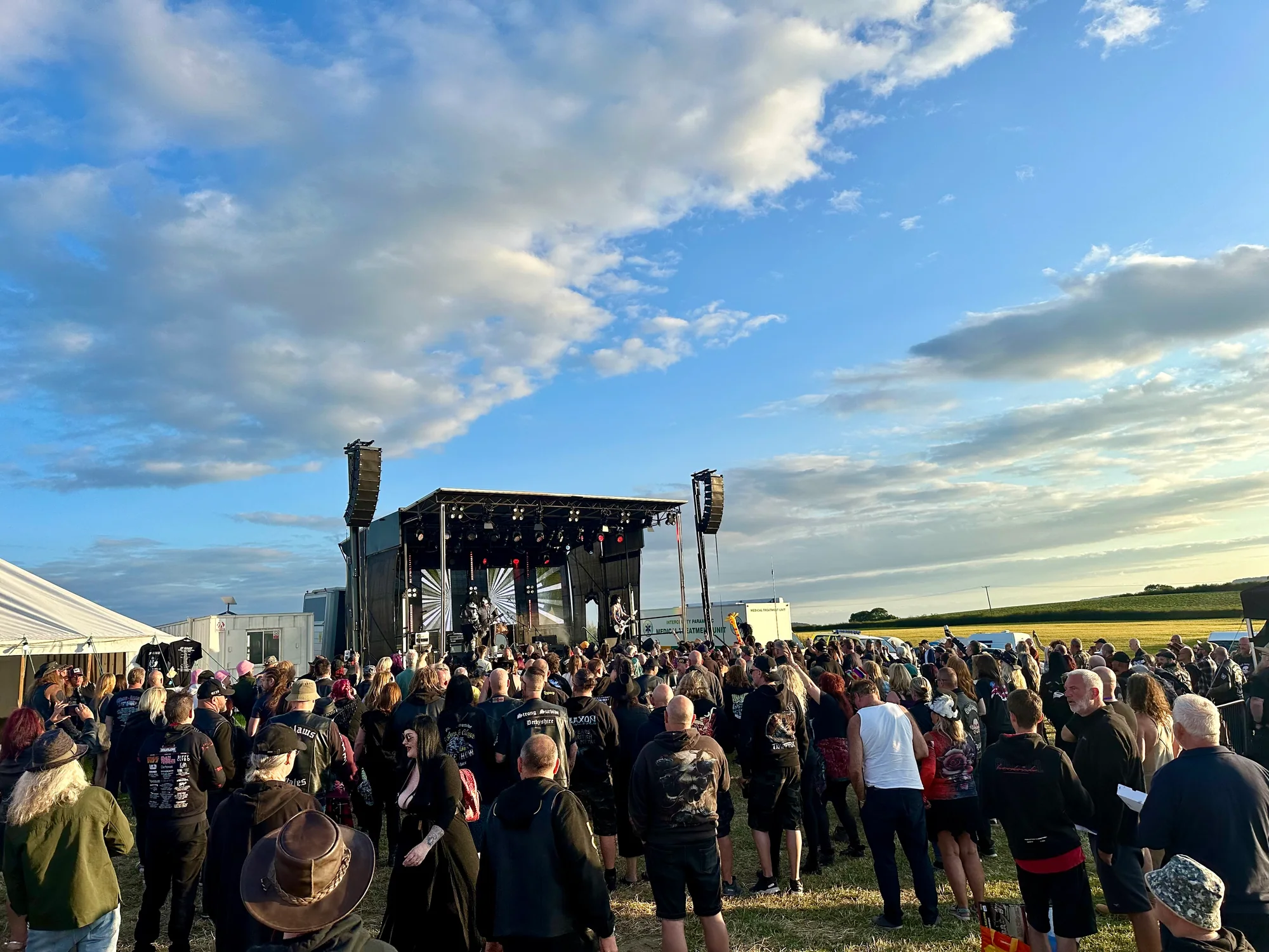 Audience watching the covered festival stage at the Rock and Blues Custom Show in Derbyshire