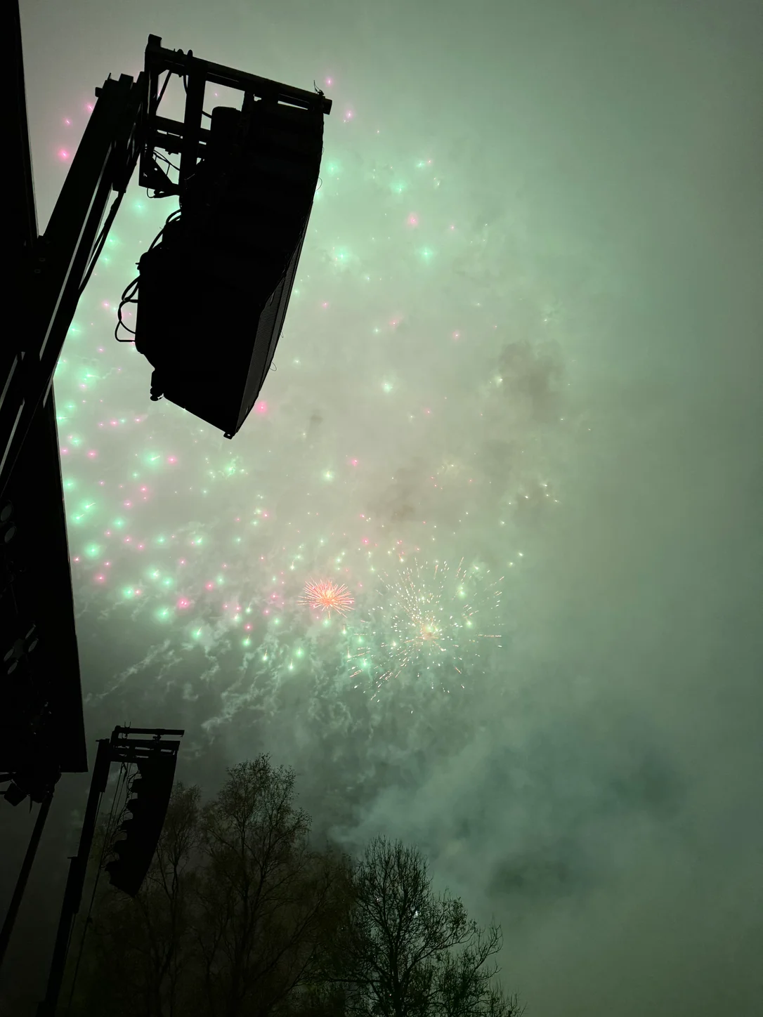 Elevated PA array at an evening outdoor event